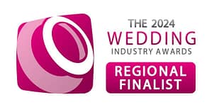 The 2024 Wedding Industry Awards Regional Finalist logo in vibrant pink and white.
