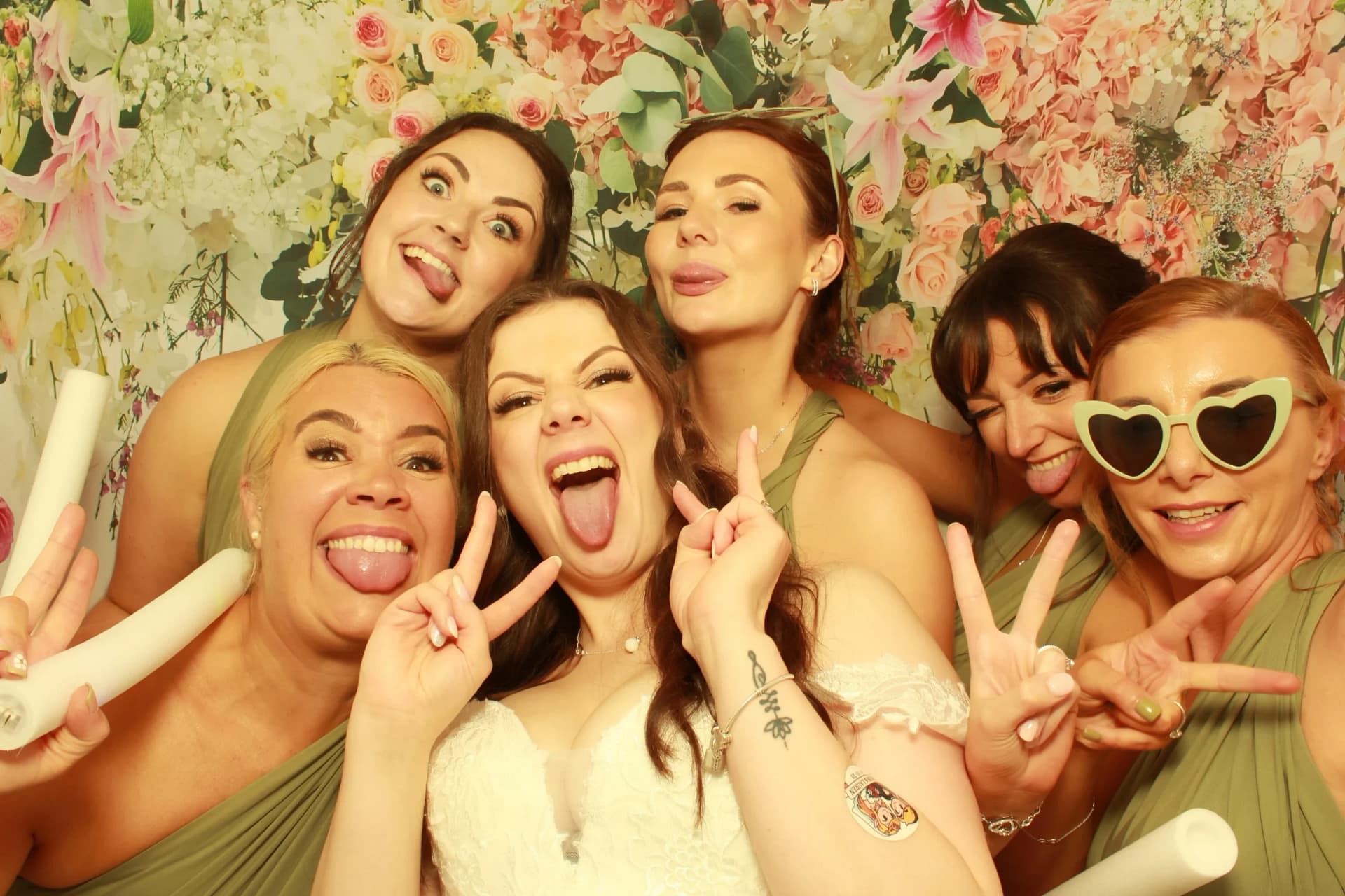 happy party goers in a photo booth