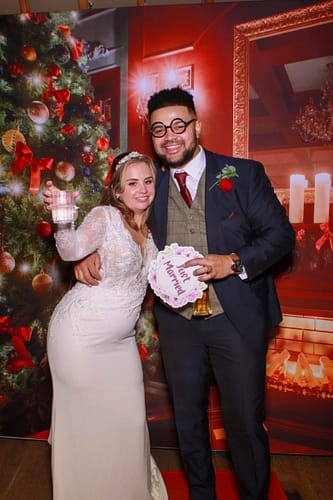 A joyful wedding party using a luxury photo booth inside the hand-crafted pavilion at Thorpe Garden, Tamworth.