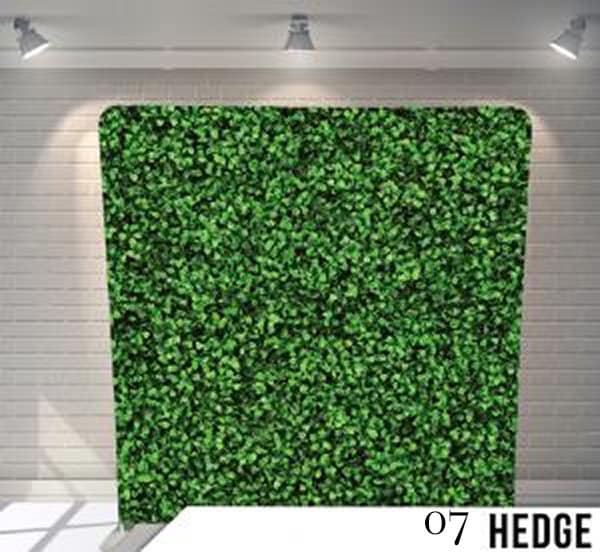 Realistic green hedge photo booth backdrop featuring dense boxwood foliage for a natural garden party look.